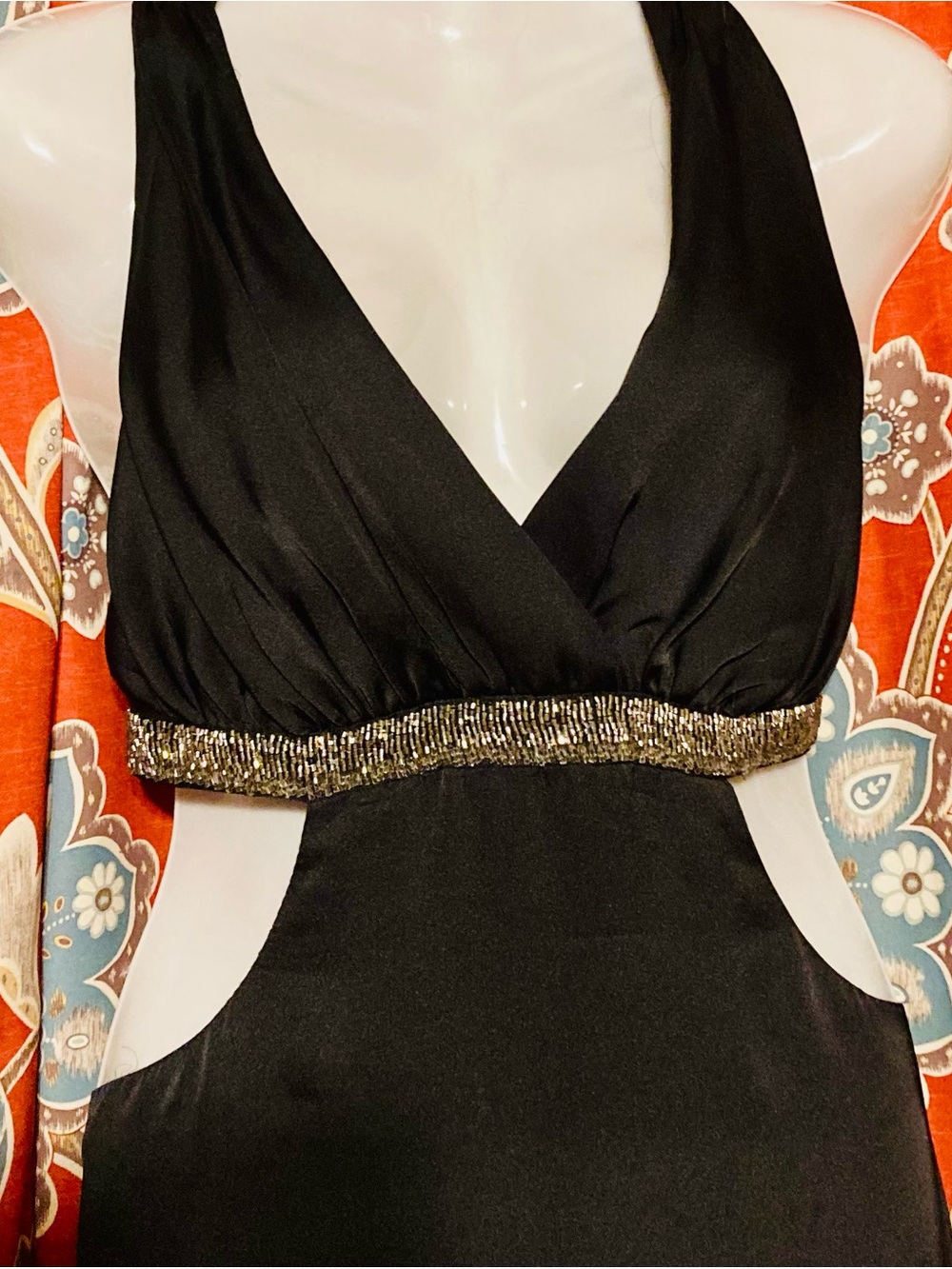 black halter neck with silver/metallic beaded waist and side cutouts